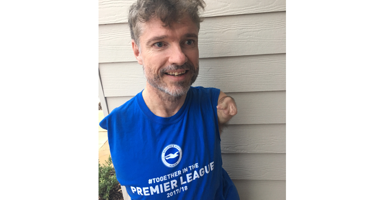 Mike Adams celebrating Brighton FC's promotion to the Premier League