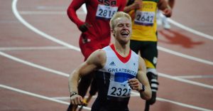 Jonny Peacock finishing a race during the London Paralympics.